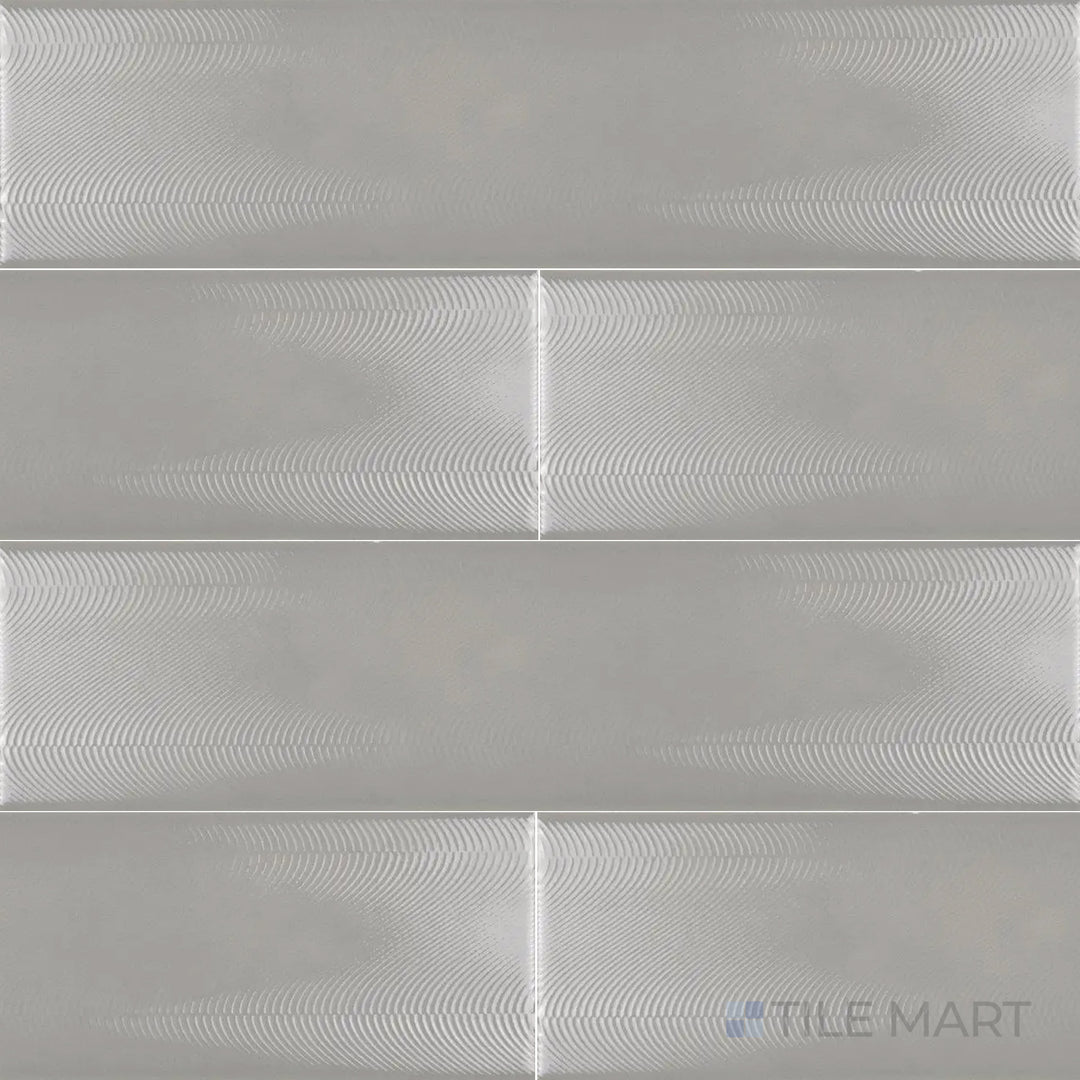 Seen from above, the Cc Cosmos Neu Gray 3x12 inch bright ceramic tile features a modern gray tone with a high-gloss surface, ideal for sleek and minimalistic designs.