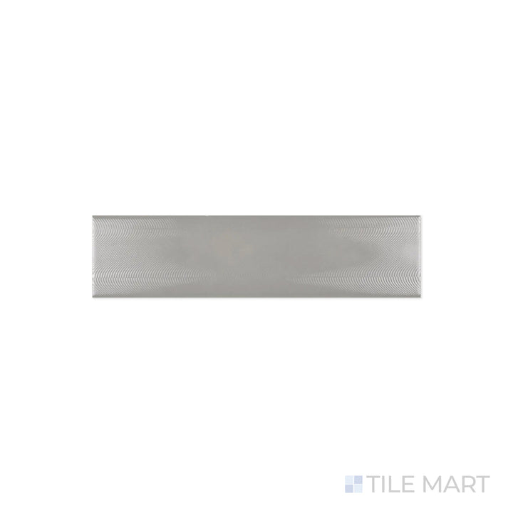 A refined close-up of Cc Cosmos Neu Gray 3X12 Bright Ceramic captures its neutral gray tone and polished ceramic texture, enhancing contemporary interiors.