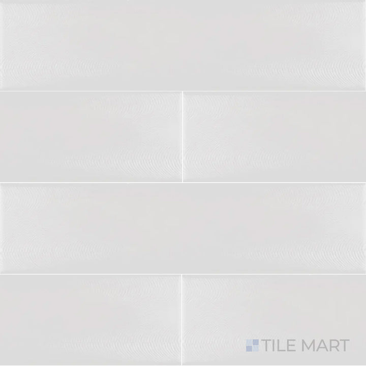 This top-down shot of the Cc Cosmos White Ice 3x12 inch bright ceramic tile presents its clean white tone and reflective glaze, enhancing brightness and elegance in any interior.