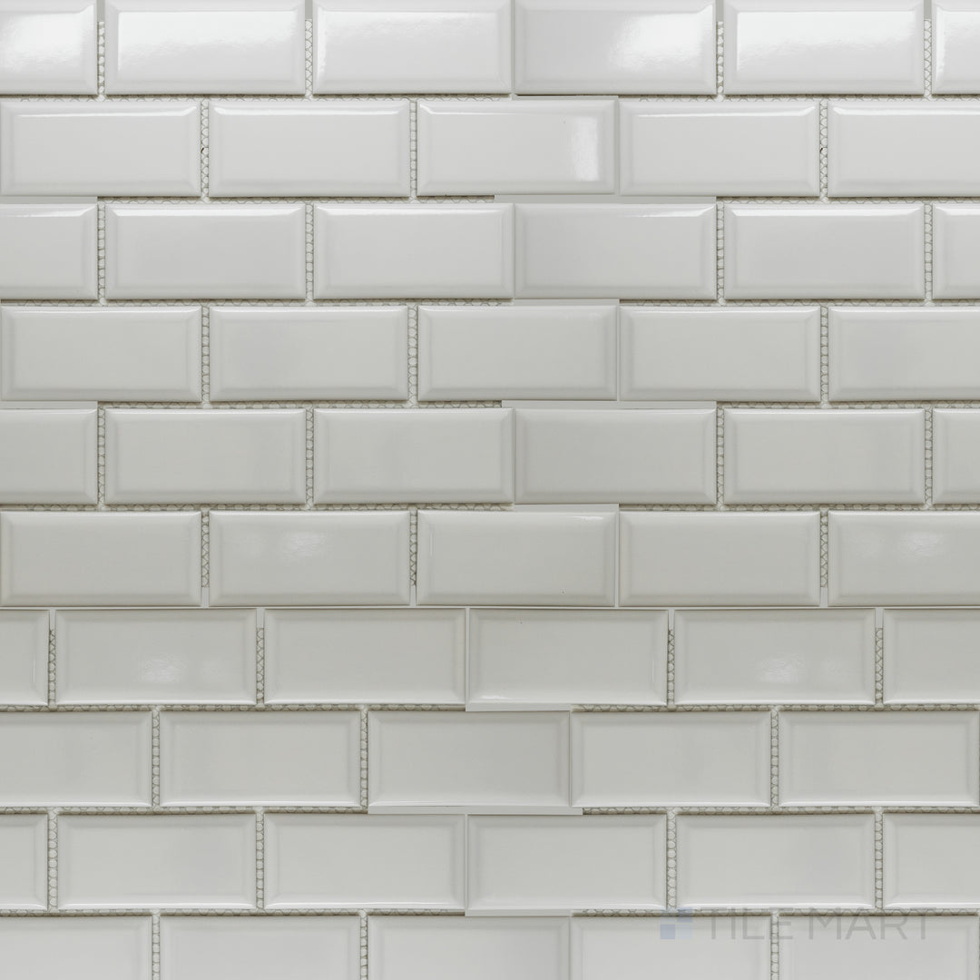 A top-down view of the Cc Mosaics Plus White Ice 2x4 inch beveled bright glazed porcelain tile showcases its crisp white tone and beveled edges, creating a dimensional and elegant effect.