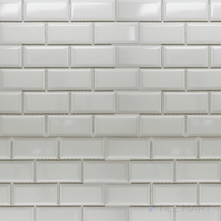 A top-down view of the Cc Mosaics Plus White Ice 2x4 inch beveled bright glazed porcelain tile showcases its crisp white tone and beveled edges, creating a dimensional and elegant effect.