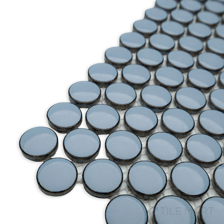 Corner shot of Cc Mosaics Plus Sky Blue penny round bright glazed porcelain tile, highlighting its circular mosaic design, sky-blue color, and luminous glazed finish.