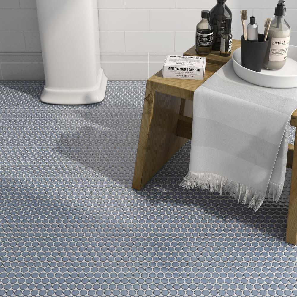 Cc Mosaics Plus Sky Blue Penny Round bright glazed porcelain tiles with a fresh blue tone and glossy finish, offering a playful yet elegant touch.