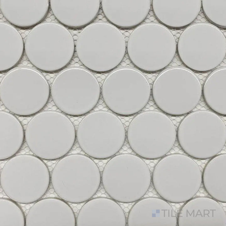 A high-angle perspective of the Cc Mosaics Plus White 2-inch Dots bright glazed porcelain tile captures its classic white tone and bright glazed finish, enhancing its clean and polished look.