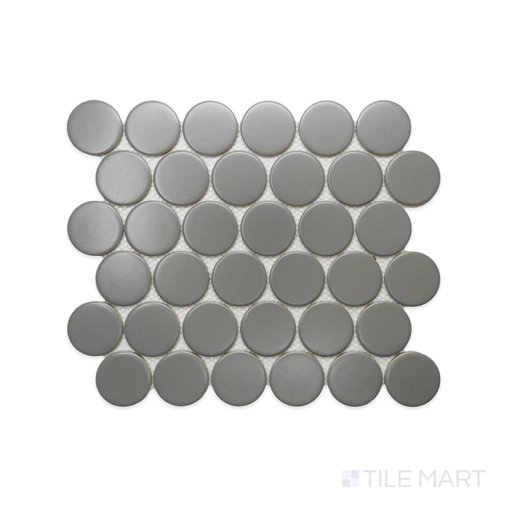 An intricate perspective of Cc Mosaics Plus Gray 2" Dots Matte Glazed Porcelain captures its cool gray hue and soft matte finish, offering a sleek yet subtle statement.