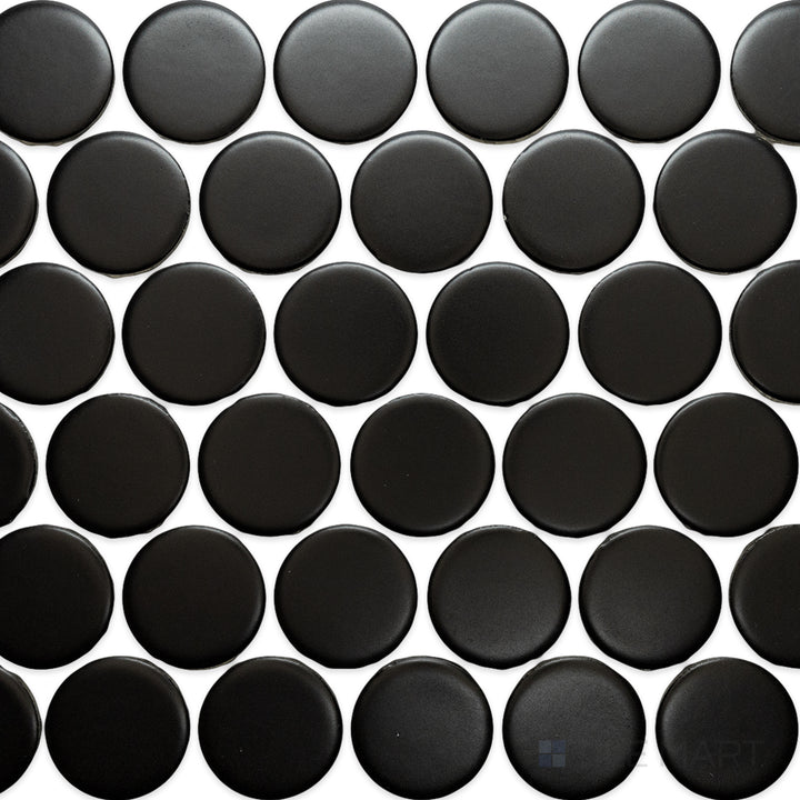 An overhead view of the Cc Mosaics Plus Black 2-inch Dots matte glazed porcelain tile showcases its bold black color and smooth matte texture, perfect for striking monochrome designs.