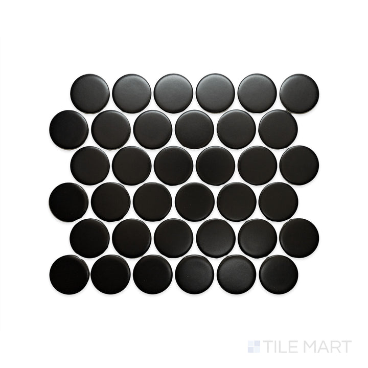 A macro view of Cc Mosaics Plus Black 2" Dots Matte Glazed Porcelain highlights its bold black tone and matte dot pattern, perfect for dramatic contrast.