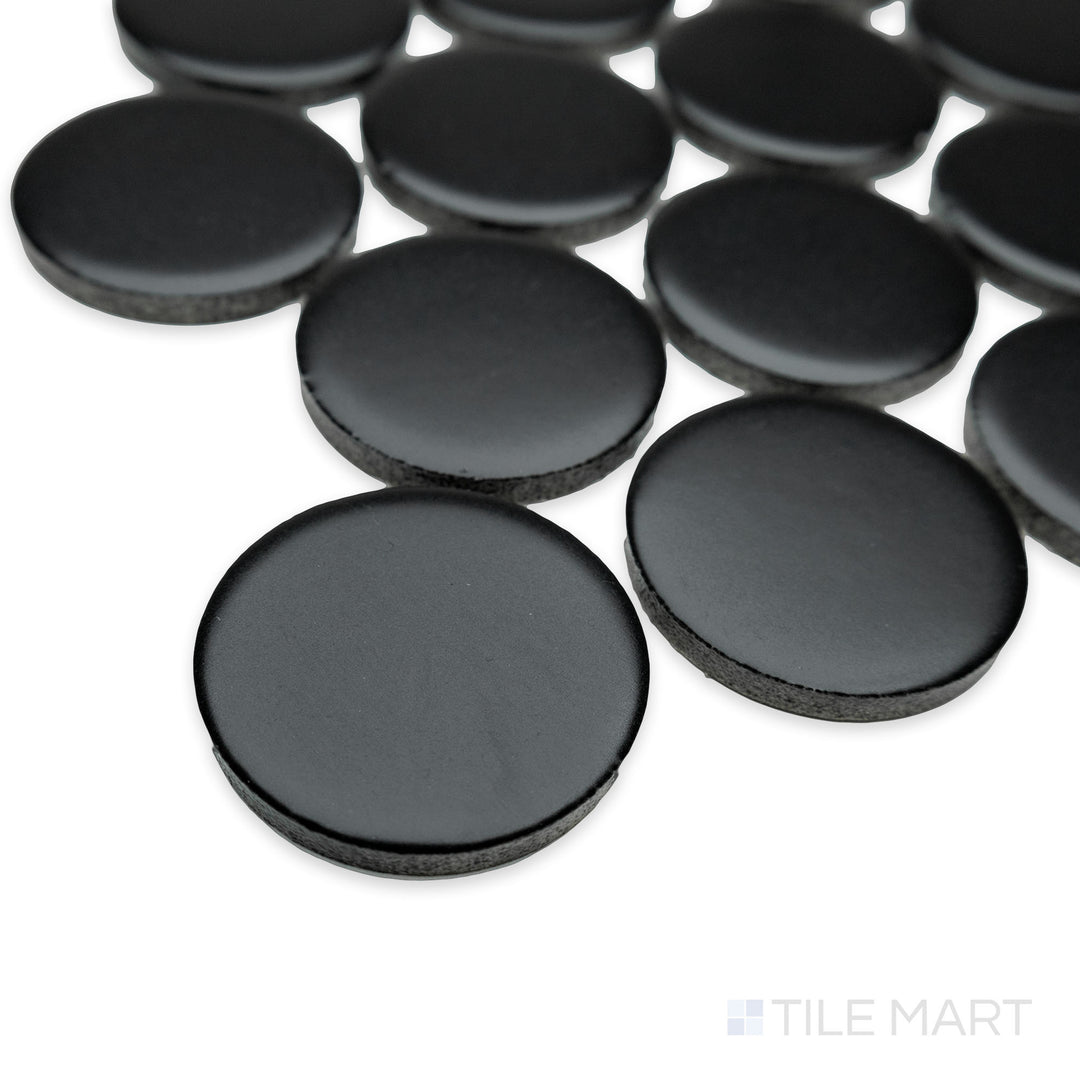 Corner shot of Cc Mosaics Plus Black 2" dots matte glazed porcelain tile, showcasing its bold black shade, modern dot pattern, and soft matte finish.