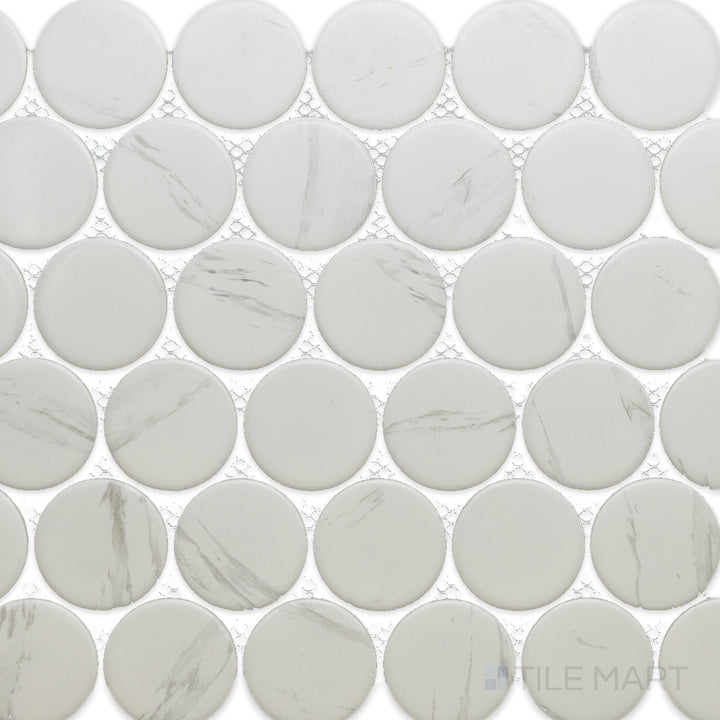 This bird’s-eye view of the Cc Mosaics Plus Carrara 2-inch Dots matte glazed porcelain tile highlights its elegant white marble look with subtle veining, adding a touch of luxury.