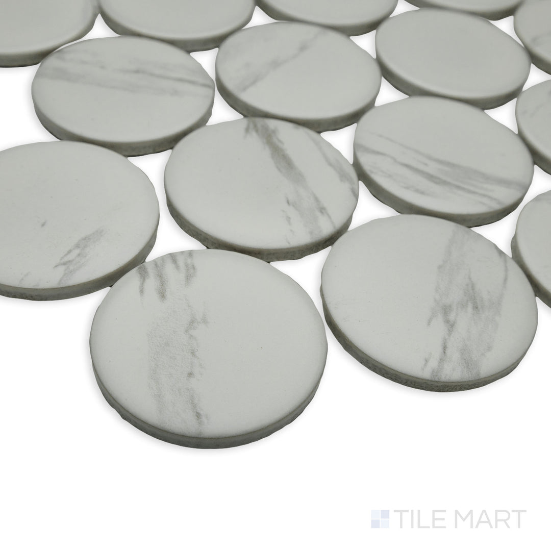 Angled perspective of Cc Mosaics Plus Carrara 2" dots matte glazed porcelain tile, featuring its elegant marble-like appearance, subtle veining, and refined dot layout.