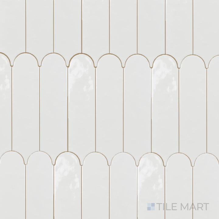 An overhead view of the Feathers White Ice 3x12 inch bright ceramic tile highlights its crisp white color and glossy finish, creating a luminous and elegant effect.