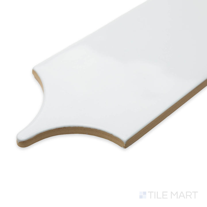 Angled view of Feathers White Ice 3X12 bright ceramic tile, showcasing its crisp white hue, polished surface, and sharp corner definition.