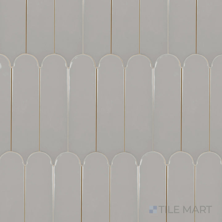 A bird’s-eye view of the Feathers Neu Gray 3x12 inch bright ceramic tile presents its sleek gray shade with a glossy glaze, adding depth and a modern touch to any space.