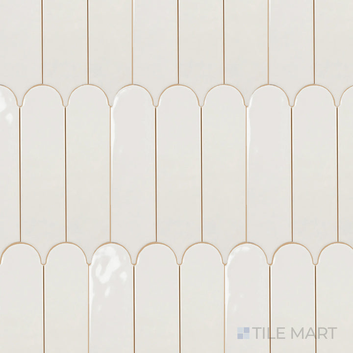 Captured from above, the Feathers Wool 3x12 inch bright ceramic tile features a warm neutral tone with a reflective surface, enhancing its soft yet contemporary appeal.