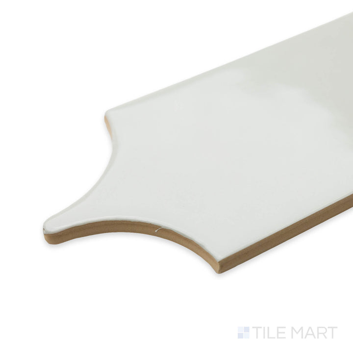 Close-up of Feathers Wool 3X12 bright ceramic tile at the corner, featuring its soft beige undertones, glossy texture, and clean tile intersection.