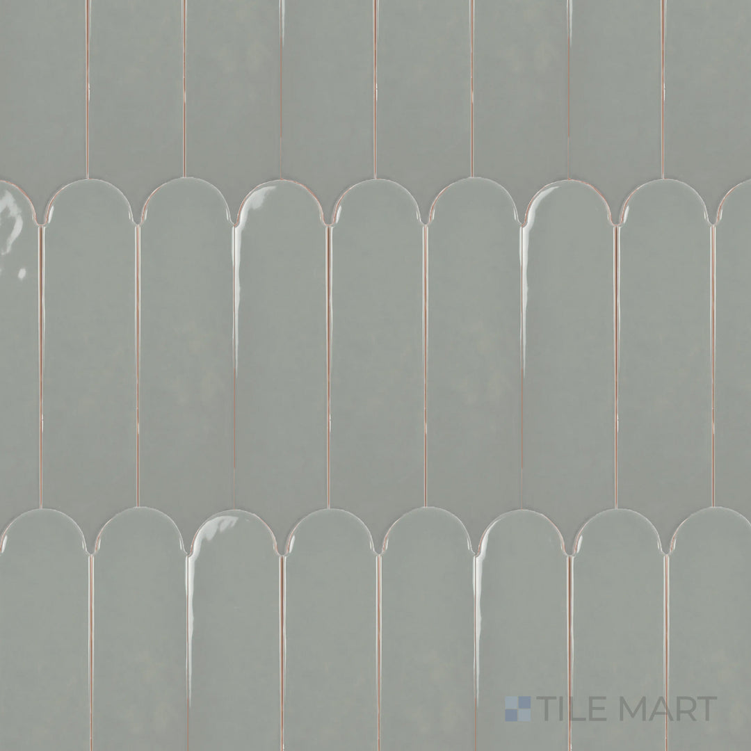 An overhead view of the Feathers Grass 3x12 inch bright ceramic tile showcases its fresh green hue and glossy finish, bringing a natural and lively touch to any space.