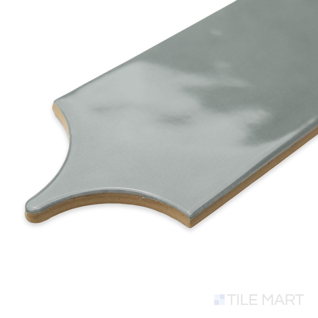 Corner-focused image of Feathers Grass 3X12 bright ceramic tile, showcasing its fresh greenish hue, smooth glazed finish, and precise edge layout.