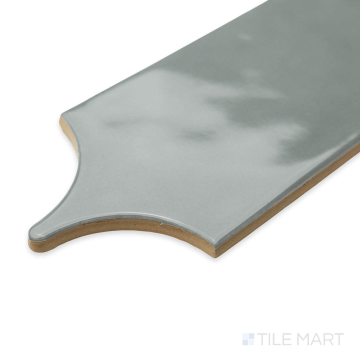 Corner-focused image of Feathers Grass 3X12 bright ceramic tile, showcasing its fresh greenish hue, smooth glazed finish, and precise edge layout.