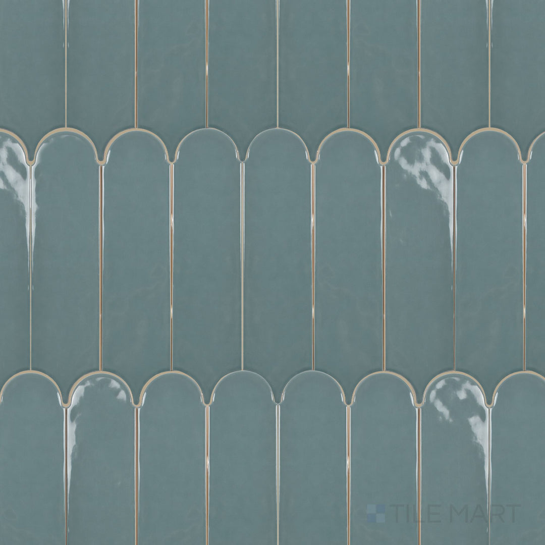 Feathers Seagrass 3x12 Bright ceramic tile shown in overview, highlighting its elongated feather-inspired shape and refreshing green-blue gloss.