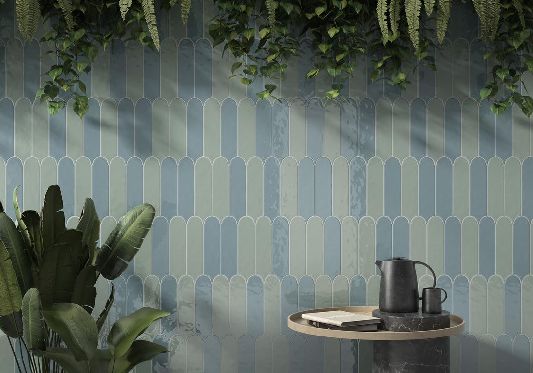 Feathers Seagrass 3x12 Bright ceramic tile styled in a lived-in environment, with natural green tones, a glossy finish, and elegant feather-inspired shape.