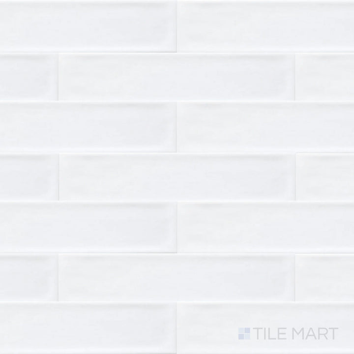 Seen from above, the Flow Frost 3x12 inch bright ceramic tile features a cool, icy white tone with a reflective glaze, adding a crisp and modern aesthetic.