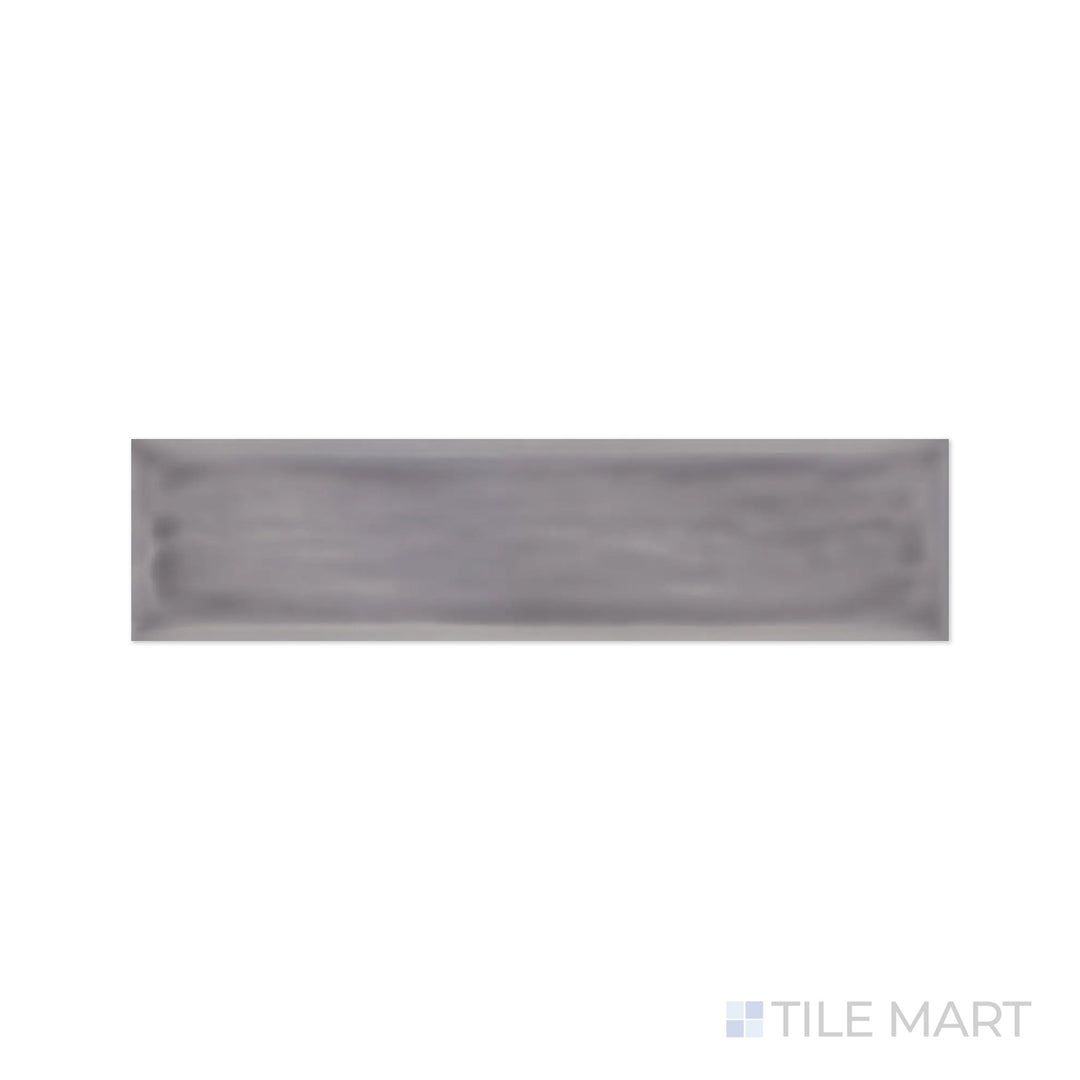 A refined close-up of Flow Lavender 3X12 Bright Ceramic showcases its soft lavender shade and luminous glossy finish, adding a serene ambiance to walls.