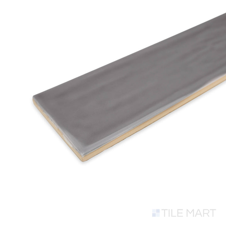 Corner-focused image of Flow Lavender 3X12 bright ceramic tile, showcasing its soft lavender hue, high-gloss sheen, and smooth tile meeting point.