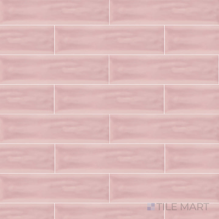 An overhead view of the Flow Velvet Pink 3x12 inch bright ceramic tile showcases its soft pink hue and glossy finish, adding a touch of warmth and elegance to interiors.