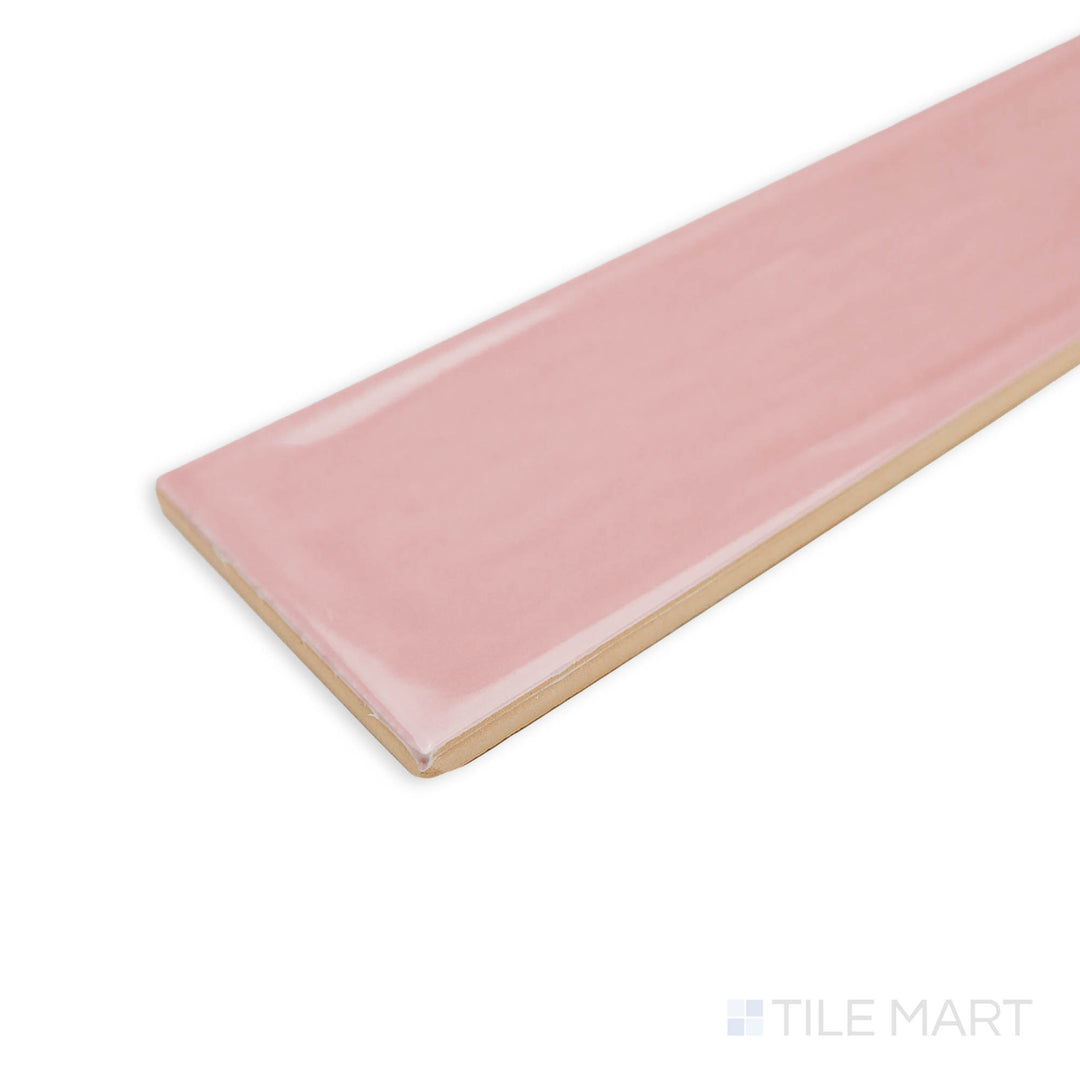 Corner shot of Flow Velvet Pink 3X12 bright ceramic tile, emphasizing its delicate pink hue, reflective sheen, and clean tile edge structure.