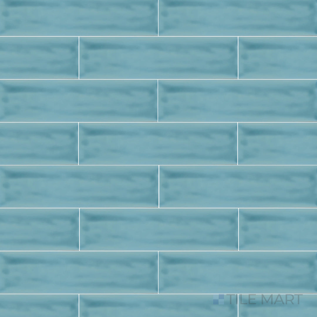 This bird’s-eye perspective of the Flow Atoll Blue 3x12 inch bright ceramic tile highlights its bold blue shade and high-gloss finish, perfect for a striking modern touch.