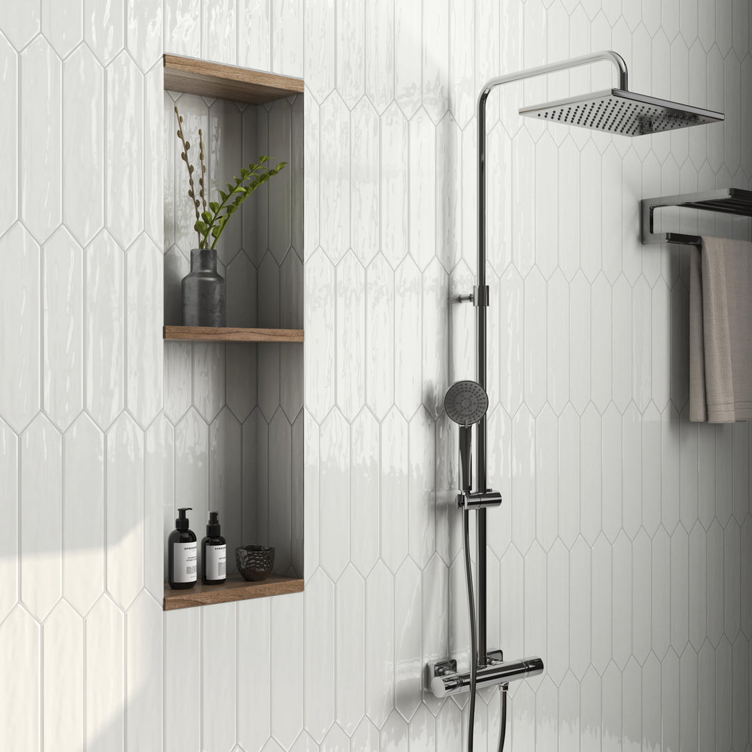 Flow White 3x12 picket bright ceramic tiles featuring a sleek, geometric shape with a polished white finish.