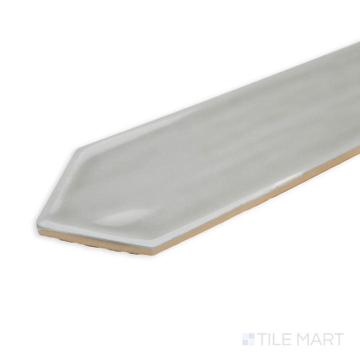 Corner shot of Flow Tender Gray 3X12 picket bright ceramic tile, emphasizing its muted gray tone, radiant surface, and precise tile intersection.