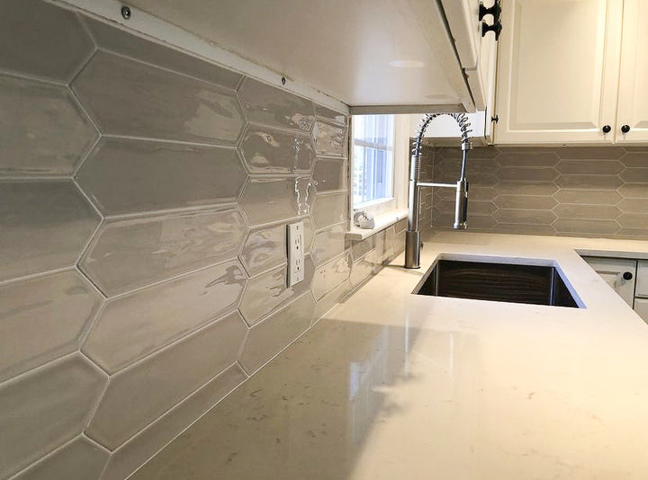 Flow Tender Gray 3x12 picket bright ceramic tiles with a refined gray tone and glossy finish for a modern touch.