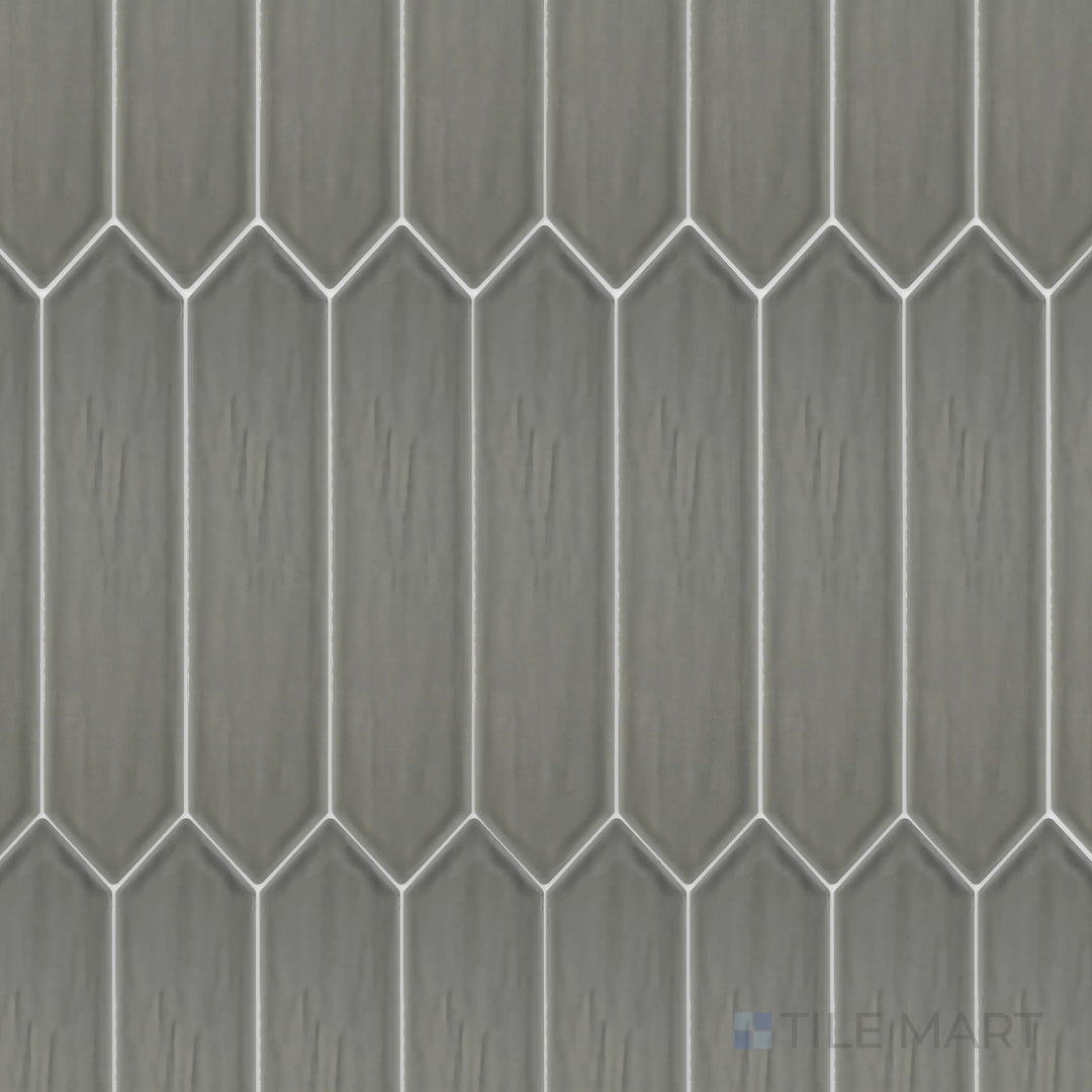 This top-down shot of the Flow Dark Gray 3x12 inch Picket bright ceramic tile highlights its deep gray color and reflective glaze, adding a sophisticated and urban appeal.