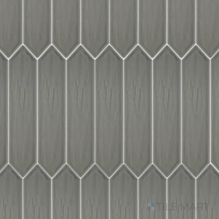 This top-down shot of the Flow Dark Gray 3x12 inch Picket bright ceramic tile highlights its deep gray color and reflective glaze, adding a sophisticated and urban appeal.