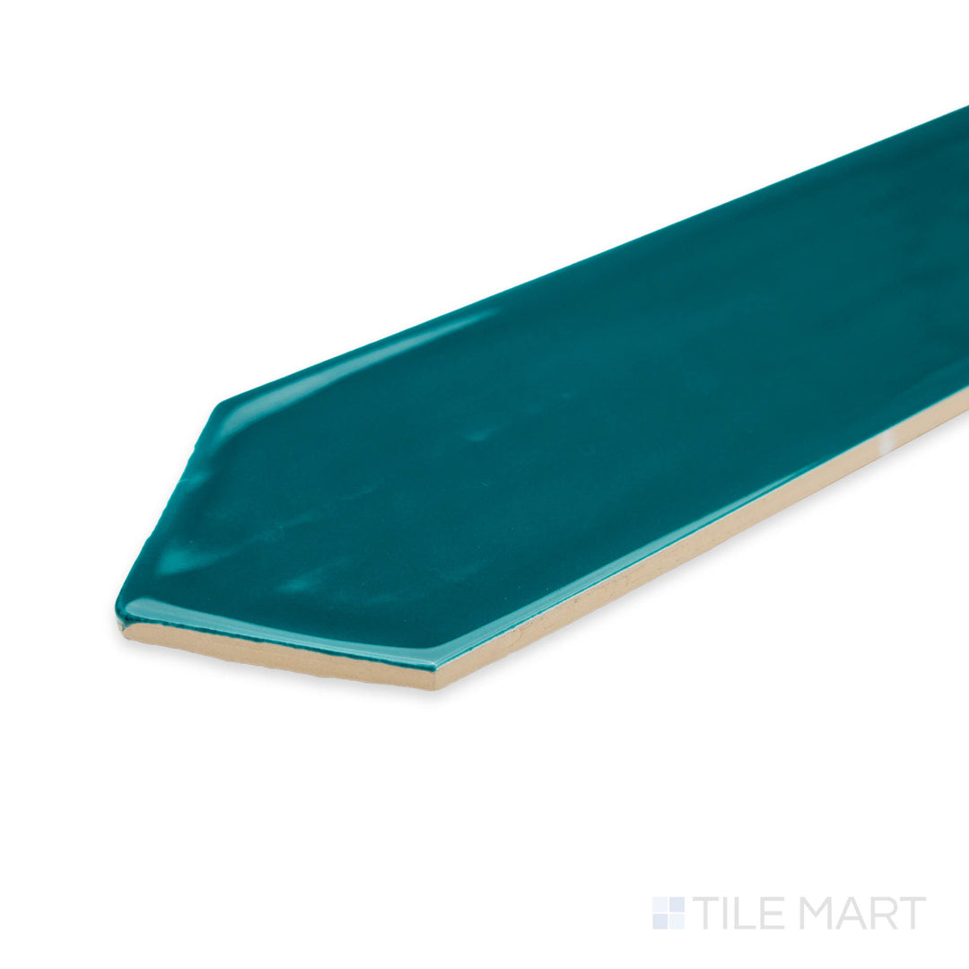 Side perspective of Flow Peacock Green 3X12 picket bright ceramic tile, highlighting its vibrant teal hue, glossy sheen, and well-defined edge alignment.