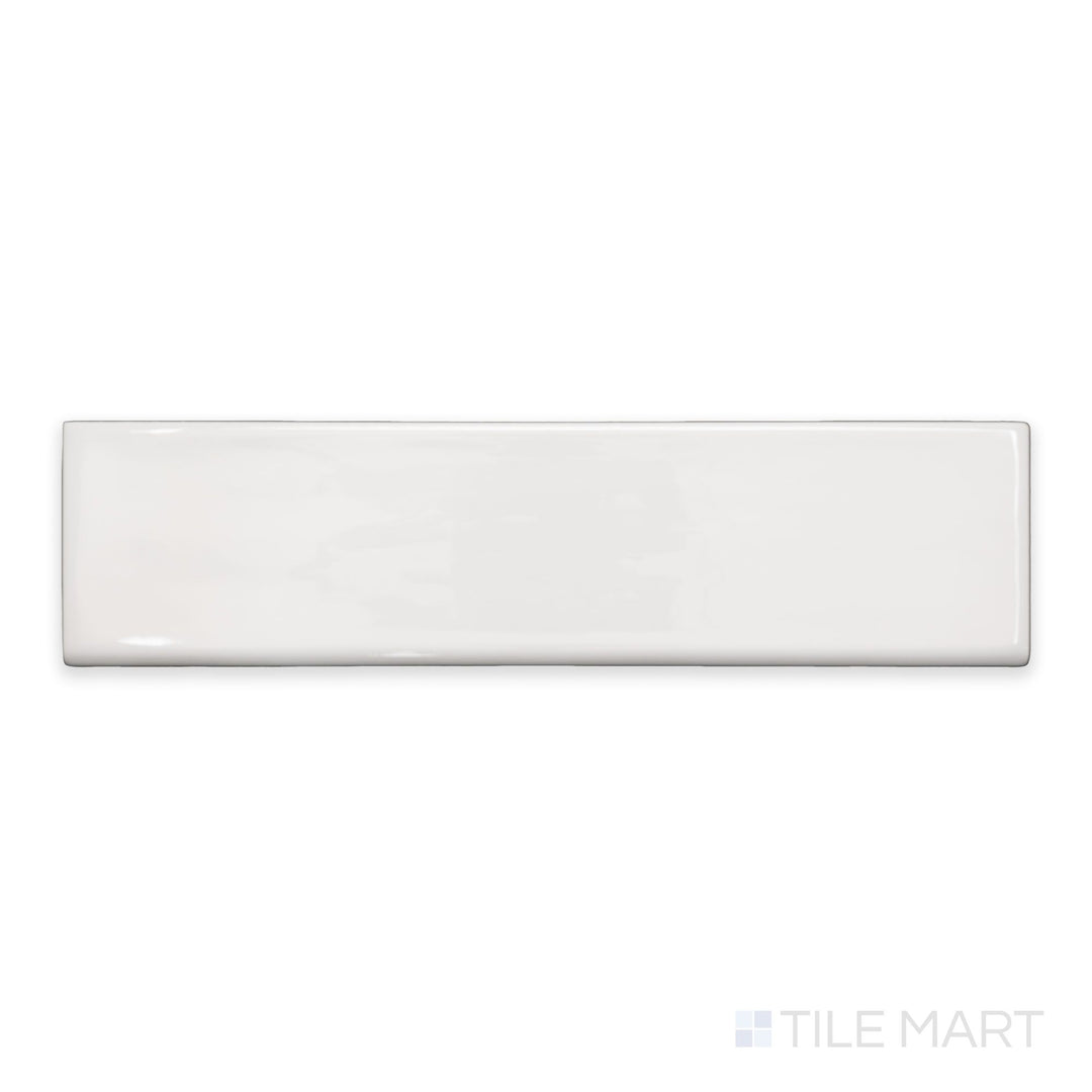 A top-down view of Flow White 3x12 bright ceramic bullnose, showcasing its elegant white color and reflective finish.