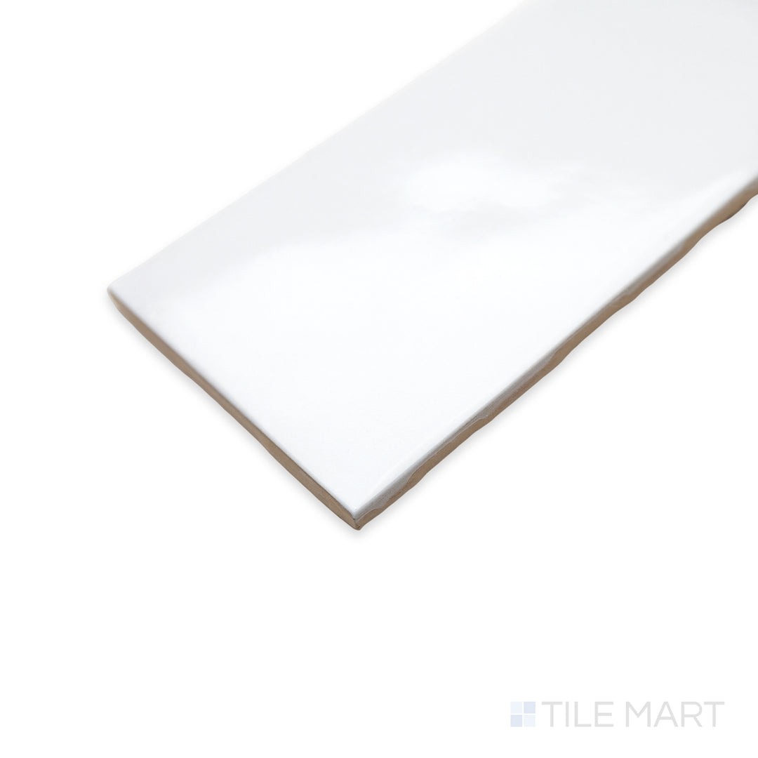 A sleek corner shot of Maiolica White 3x6 bright ceramic tile, emphasizing its crisp white color and glossy finish that enhances light and space.