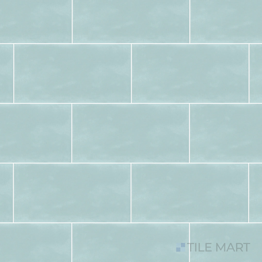 An overhead view of the Maiolica Aqua 3x6 inch bright ceramic tile captures its refreshing aqua hue and glossy sheen, bringing a vibrant and soothing aesthetic.
