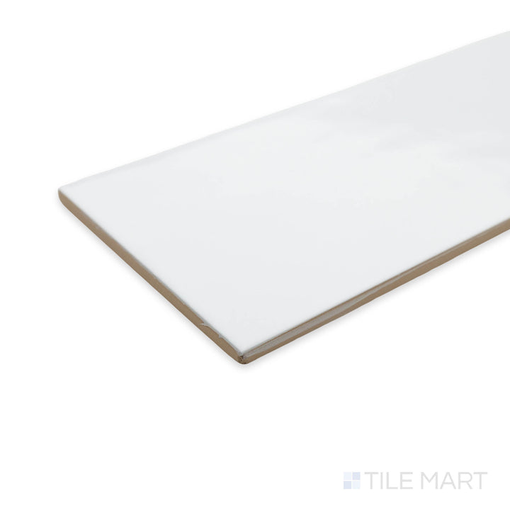 A bright and timeless Maiolica White 4x10 ceramic tile captured in a corner shot, highlighting its glossy surface and clean, elegant aesthetic.
