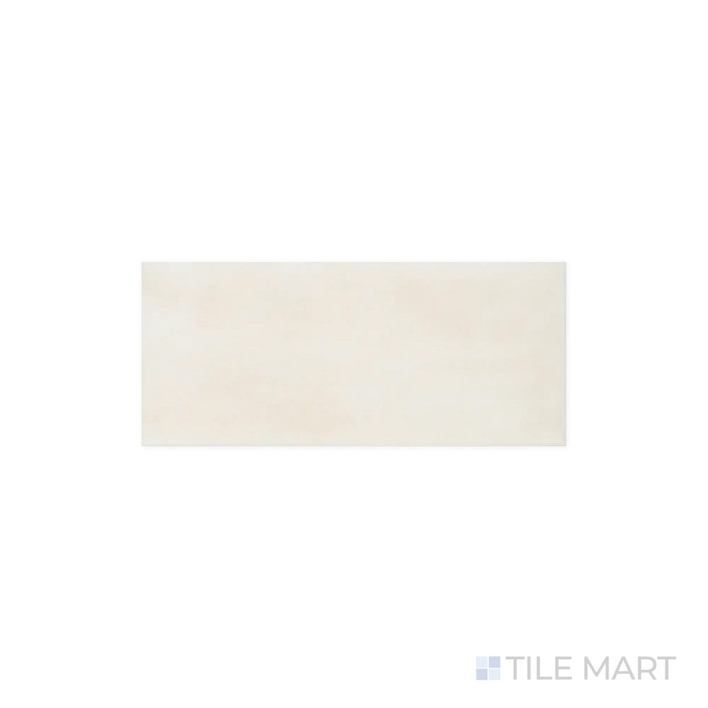 Detailed view of Maiolica Biscuit 4x10 Bright Ceramic Tile, highlighting its warm beige shade and glossy surface. The finish enhances the color variation, creating a sophisticated effect.