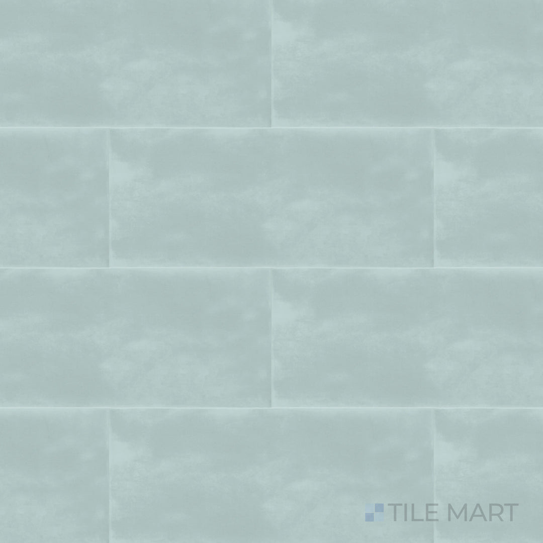 A high-angle view of the Maiolica Aqua 4x10 inch bright ceramic tile presents its lively aqua color and glossy sheen, creating a fresh and dynamic look.