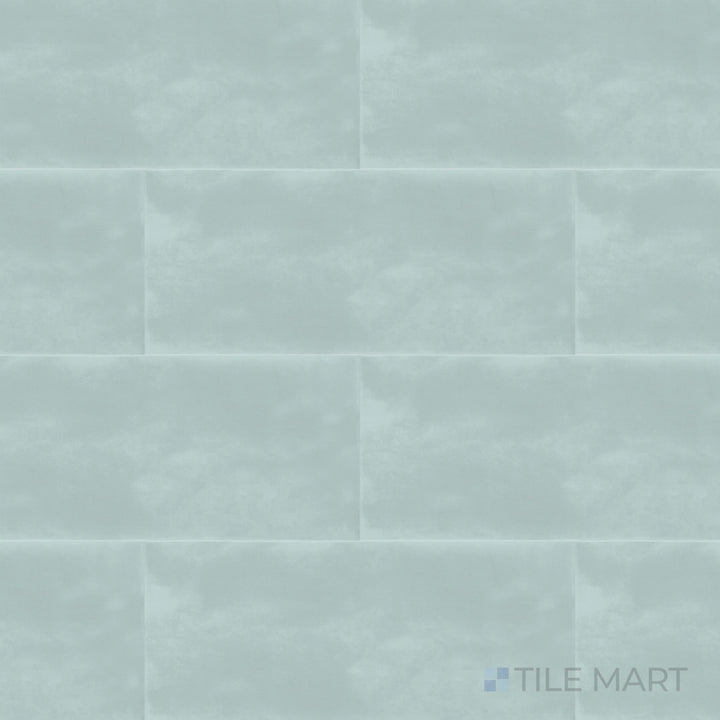 A high-angle view of the Maiolica Aqua 4x10 inch bright ceramic tile presents its lively aqua color and glossy sheen, creating a fresh and dynamic look.