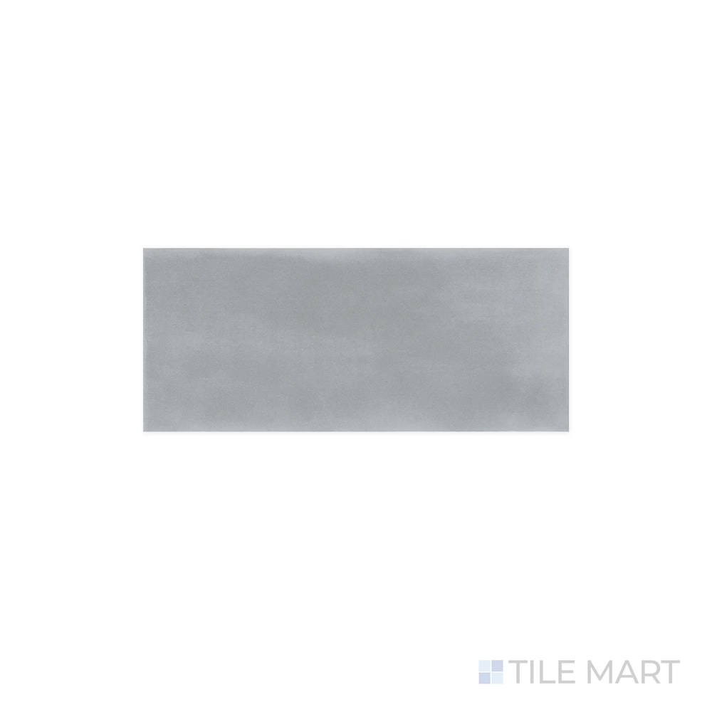 A detailed look at Maiolica Taupe 4x10 Bright Ceramic Tile, where the neutral color and reflective finish blend seamlessly. The glossy surface highlights subtle shading variations.