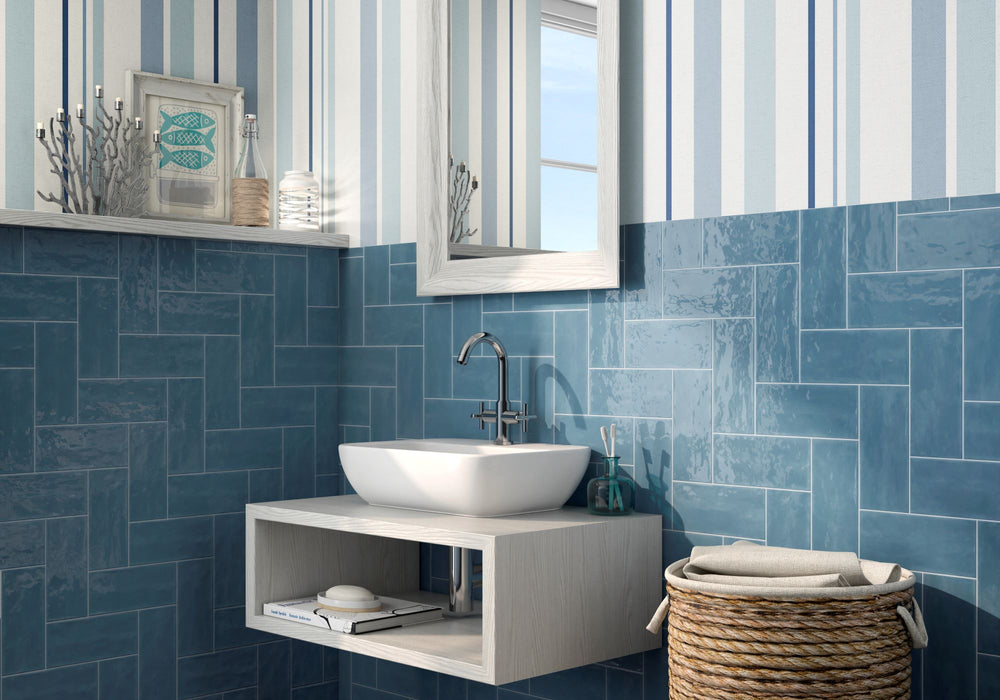 Elevate interiors with the deep, striking hues of Maiolica Blue Steel 4X10 bright ceramic tile, adding a bold and luxurious statement.