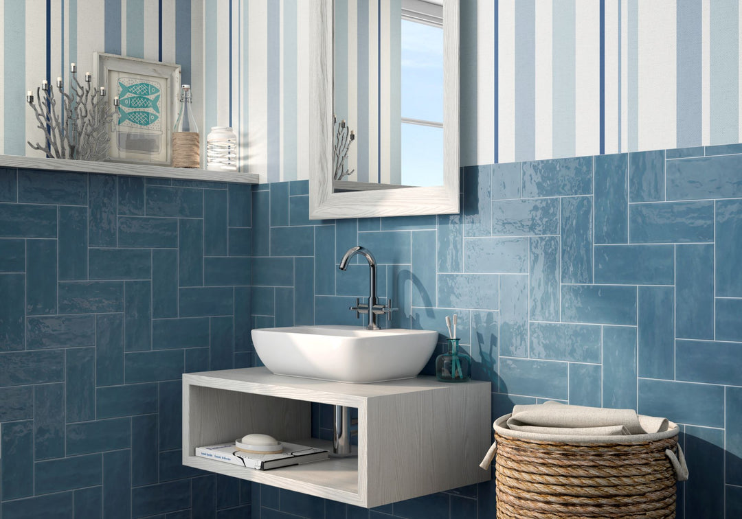 Elevate interiors with the deep, striking hues of Maiolica Blue Steel 4X10 bright ceramic tile, adding a bold and luxurious statement.