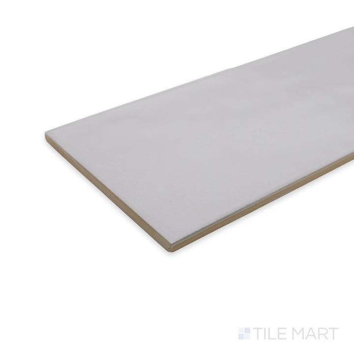 Soft yet sophisticated, the Maiolica Tender Gray 4x10 matte ceramic tile in a corner shot showcases its smooth, non-reflective finish for a refined, understated look.