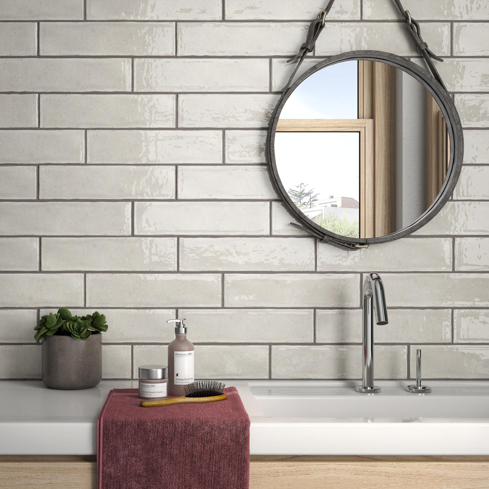 Maiolica Biscuit 3x12 bright ceramic tiles with a warm, neutral beige hue and polished finish for a soft, inviting look.