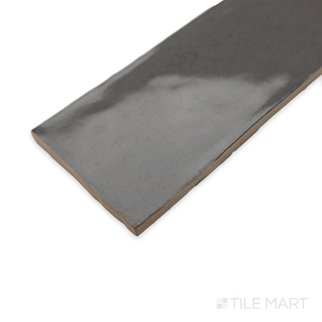 Maiolica Taupe 3x12 bright ceramic tile in a stylish corner shot, featuring its earthy brown tones and glossy texture for a timeless design.