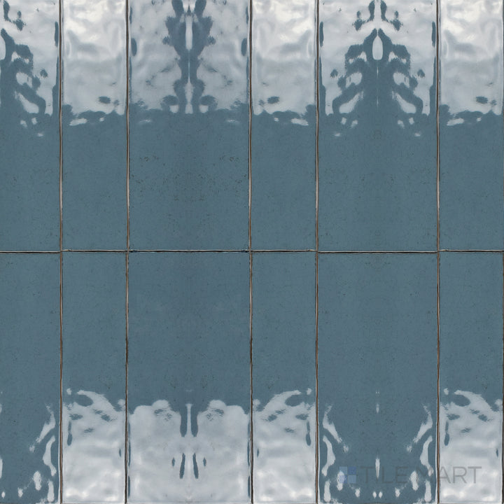 This bird’s-eye perspective of the Maiolica Blue Steel 3x12 inch bright ceramic tile highlights its deep blue-gray shade and high-gloss finish, perfect for a bold and stylish look.